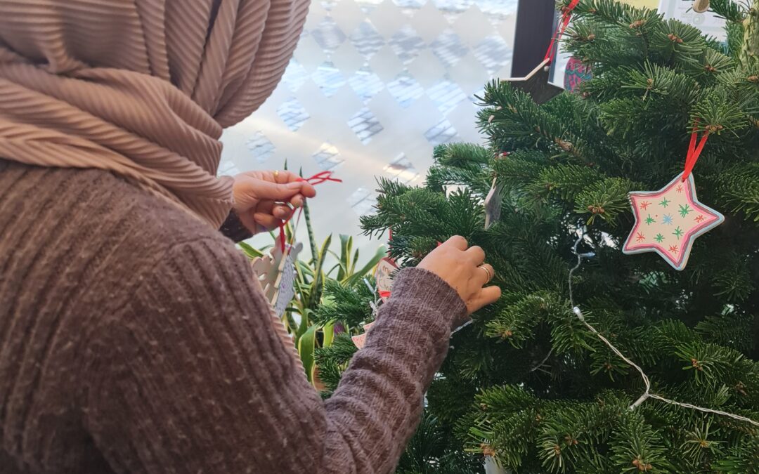 Parents decorating the Christmas Tree